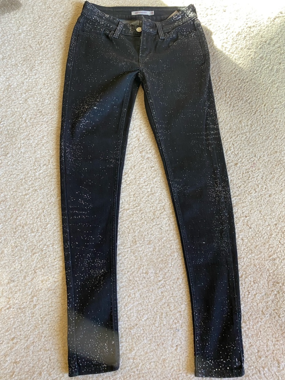 Levi’s  black with silver sparkles special edition stretch leggings, size 25